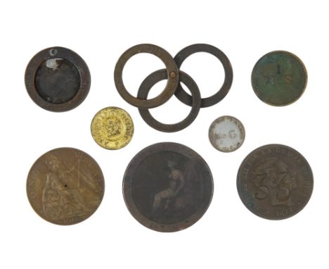 A coin weight, an apothecary weight and other stamped coins.