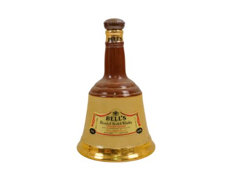A Bell's whisky decanter - in a brown glazed bottle.