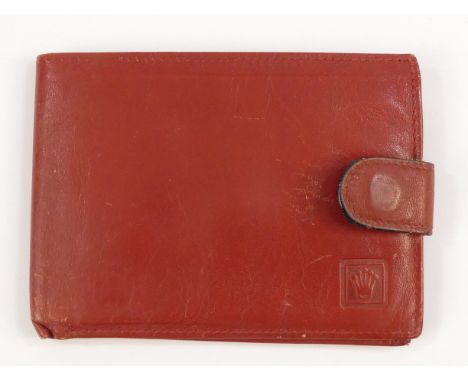 A red leather Rolex wallet - with press-stud closure and Rolex blindstamp.