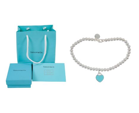 A silver bead child's bracelet by Tiffany - together with bag, box and polishing cloth.