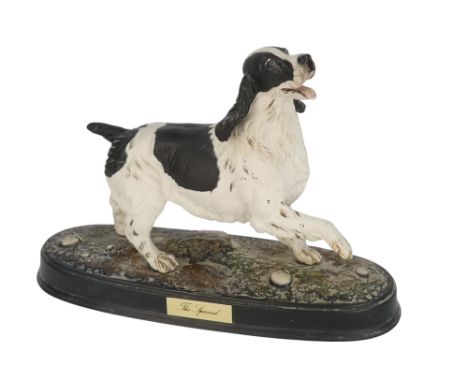 A Beswick figure of a dog - The Spaniel, in an alert pose, 22cm high.