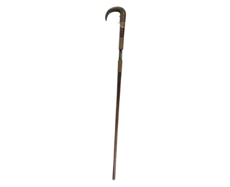 A 19th century walking stick gun or poacher's stick - with brass ferrules and a horn handle, with a faux rosewood finish, 88c