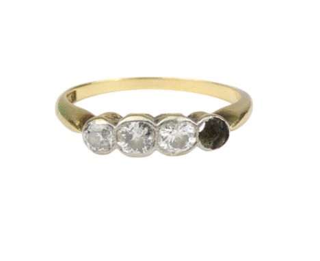 An 18ct gold diamond set ring - the four stone ring with one vacant setting, size O, 2.6g.