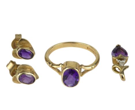 A 9ct gold and amethyst suite of jewellery - comprising a ring, a pair of ear studs and a heart shaped pendant, ring size M-N