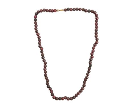 A uniform red bead necklace - length 41cm. 