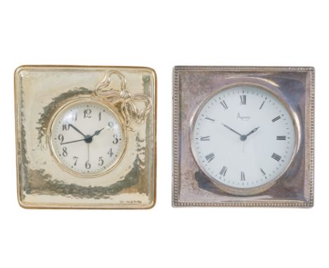 A silver framed alarm clock by Asprey - London 1986, square with a bead border, the white dial set out with Roman numerals, t