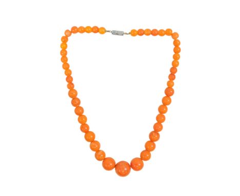 A golden amber style necklace - of graduated circular beads, length 42cm.