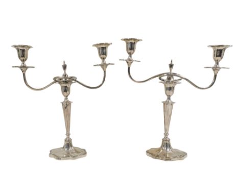 A pair of twin branch candelabra - Sheffield 1910, Walker &amp; Hall, in the neo-classical style, with shaped oval sconces an
