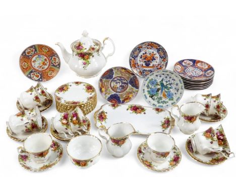 A Royal Albert Old Country Roses tea service - for twelve place settings comprising a teapot, two milk jugs, sucrier, rectang