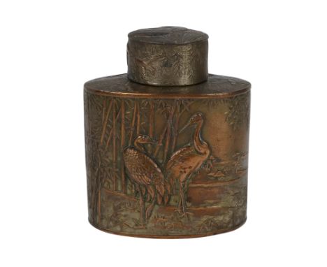 An early 20th century Chinese tea caddy - oval and decorated with a crane amongst bamboo, 12cm high.