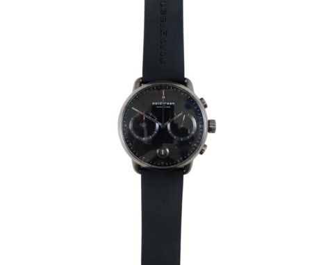 A Nordgreen gentleman's wristwatch - the black dial with two subsidiary dials and date aperture, boxed with two spare straps.