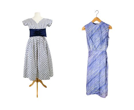 A vintage summer dress - by California Cottons, blue stars on a white ground with a broad blue bow to waist, approx size 14, 