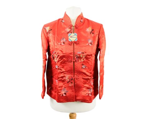 A ladies Chinese red silk jacket - decorated with flowers with gilt reversable lining, size 38.