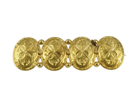 An 18ct gold bar brooch - composed of four oval foliate engraved shields, 10.1g.