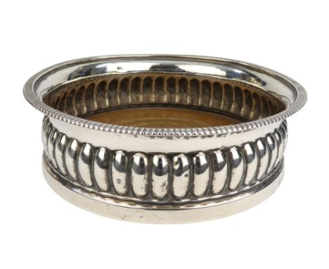 A George IV wine coaster - Sheffield 1826, James Fenton &amp; Co., of reeded decoration, 14cm diameter.