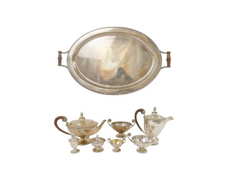 A silver tea and cruet service - Sheffield mixed dates circa 1932, comprising a teapot, water jug, sucrier, milk jug, mustard