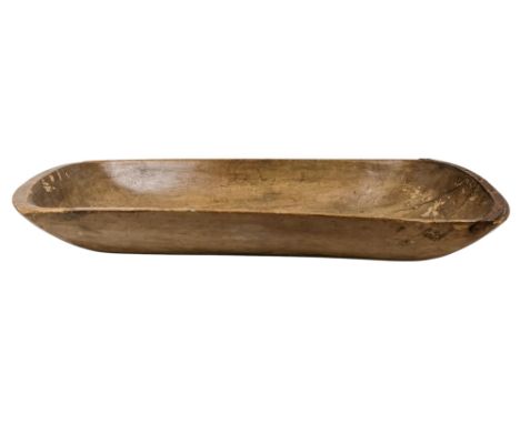 A 19th century hardwood grain trough - of rounded rectangular form and with an iron bracket to one end, 100cm wide.