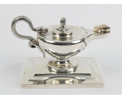 A silver table lighter - London 1899, Edward Barnard, of lamp form with a serpent handle and raised on a stepped rectangular 