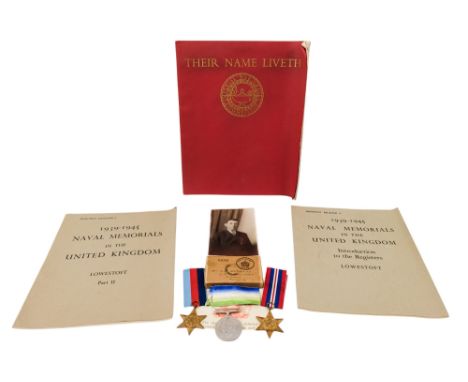 A WWII medal group - comprising 1939-45 Star, Atlantic Star and 1939-45 War Medal, together with a photograph and three paper