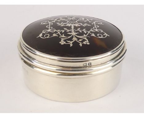 A silver and tortoiseshell pique trinket box - Birmingham 1910, Levi &amp; Salaman, circular with floral decoration, 28g.
