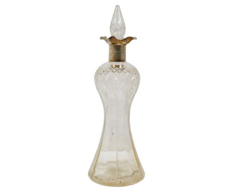A silver mounted decanter - Birmingham 1924, clear cut glass of faceted baluster form, 34cm high.