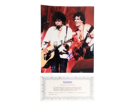 Keith Richards and Bob Dylan - a photograph of the two musicians performing together at Live Aid, 1985, signed in black and b