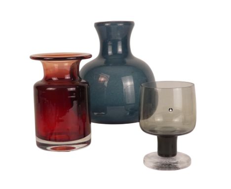 A Pukeberg, Sweden smoke glass footed goblet - height 13.5cm, together with a blue speckled glass vase, height 18.5cm and a r
