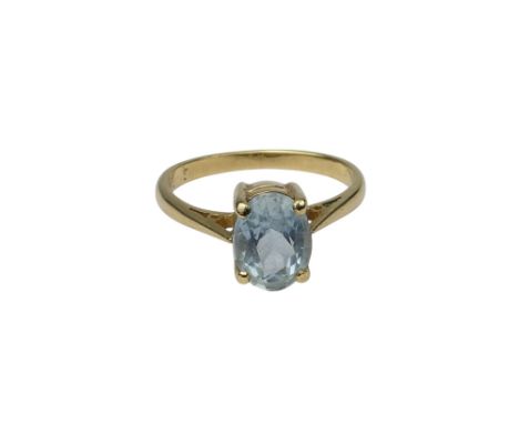 A 9ct gold and aquamarine ring - claw set with an oval cut ring, size K, 1.8g.