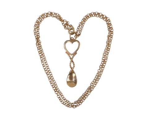 A 9ct Welsh gold love spoon - on a fine link 9ct chain, 4.9g.