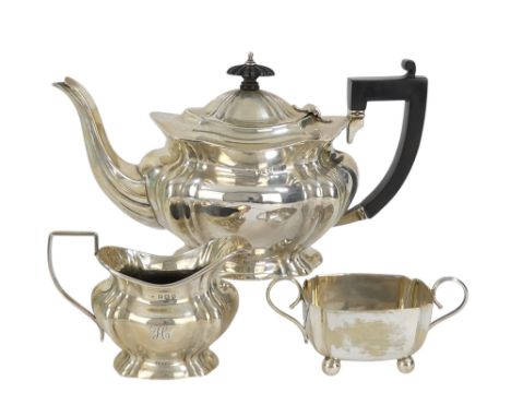 A silver tea pot - Birmingham 1938, of bulbous ogee form, together with a matching milk jug, 541g and an associated silver pl