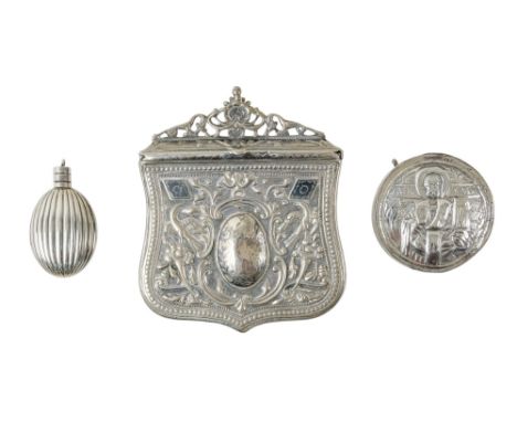 A Middle Eastern white metal belt pouch - repousse decorated with birds and flowers around a central cartouche engraved with 
