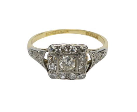 A vintage 18ct gold diamond cluster ring - the square plaque with a central stone bordered by a further twelve stones and dia