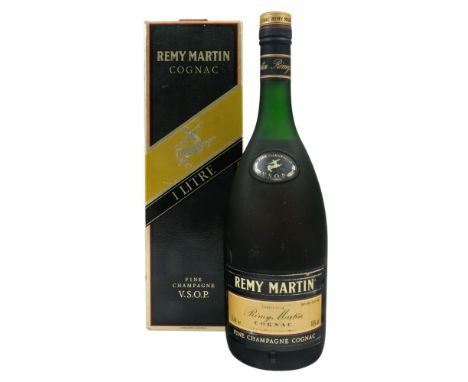 A bottle of Remy Martin cognac - one litre, in a card presentation box.
