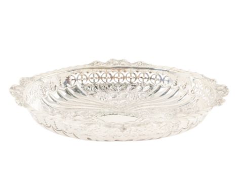 A silver bonbon dish - Birmingham 1898, oval with fruit repousse and a pierced band, 187g.