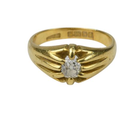 A 18ct gold diamond gypsy set ring - size Q, 6.4g.