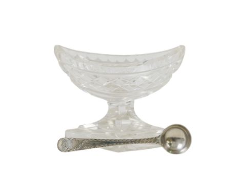 A 19th century cut glass salt - navette shaped and raised on a foot, together with a bright cut silver spoon, circa 1780, pos