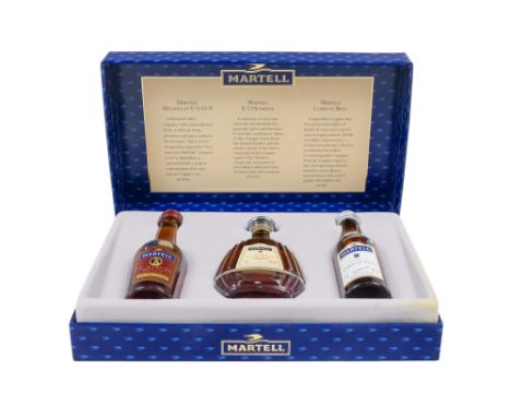 A Martell cognac gift set - comprising three miniature bottles in a presentation box.