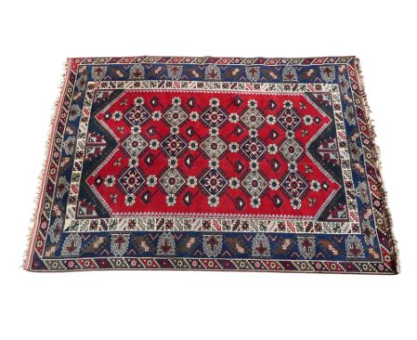 An Anatolian rug - with an arrangement of fifteen gulls on a red ground, the blue border with serrated foliate designs, 264 x