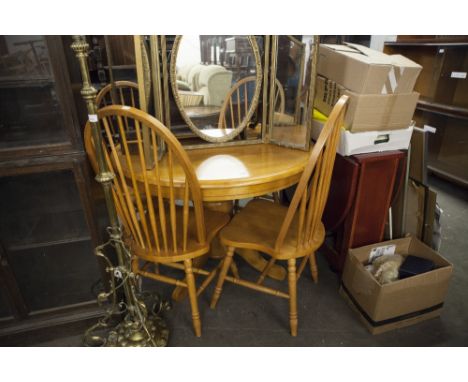 A MODERN BUTTERFLY EXTENDING BREAKFAST TABLE AND FOUR CHAIRS WITH STICK BACKS 