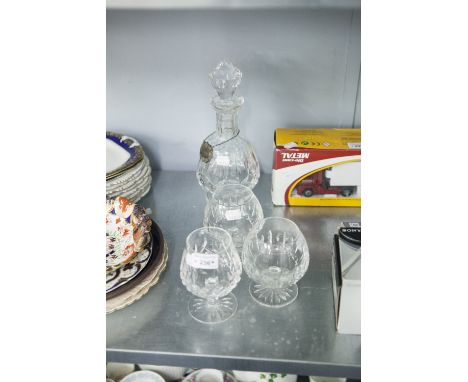 WATERFORD CRYSTAL BRANDY BALLOON, CUT GLASS DECANTER, TWO OTHER BRANDY BALLOONS, AND A SILVER BRANDY LABEL 