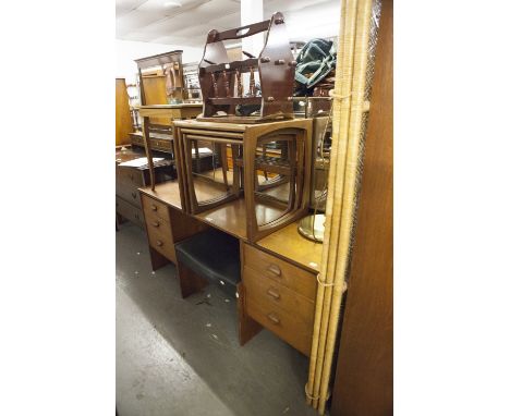 A 1960'S OAK BEDROOM SUITE, COMPRISING; A PEDESTAL DRESSING TABLE WITH TRIPLE MIRROR, EACH PEDESTAL WITH THREE GRADUATED DRAW