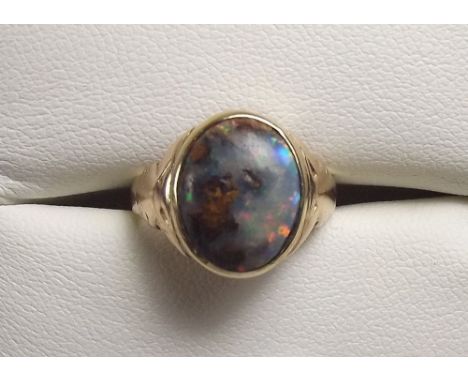 An Australian boulder opal ring set in gold (not hallmarked) , size J