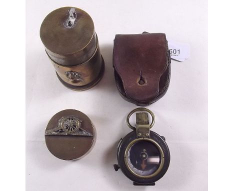 A WWI compass in leather case and a Royal Artillery brass table lighter