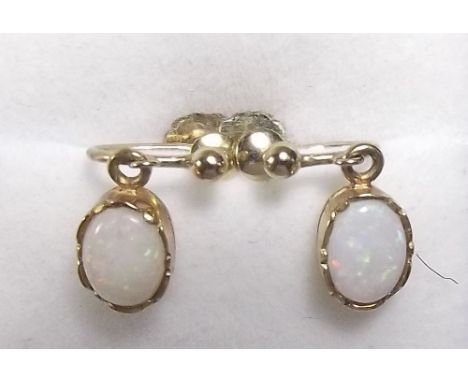 A pair of opal drop earrings in 9 carat screw clips