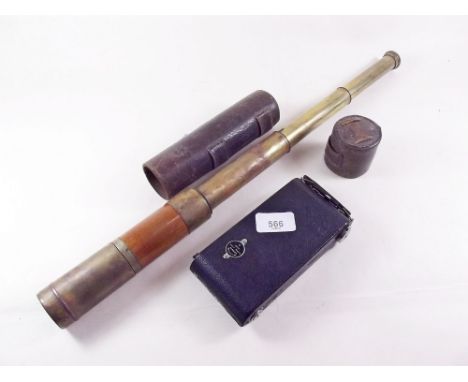 A brass and mahogany four drawer telescope in leather case and a folding Kodak camera