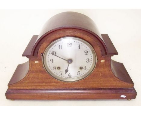 An Edwardian mahogany mantel clock with decorative inlay