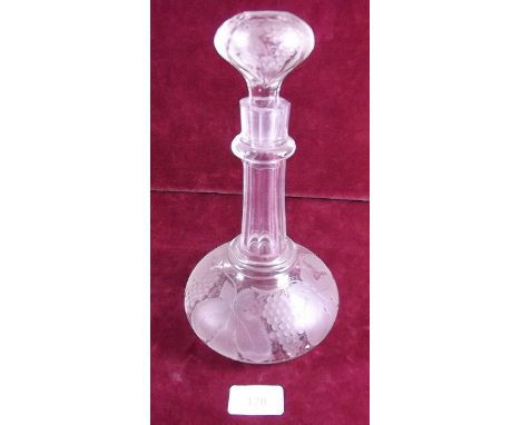 A Victorian cut glass decanter and stopper engraved vines