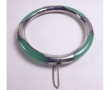 A jade and white metal bangle
