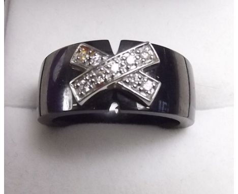 A ceramic and diamond set ring, size M