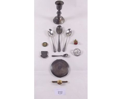 A group of silver items including compact, two sports badges, a part gold bar brooch, various silver spoons etc